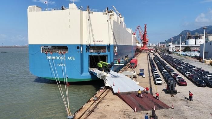 Vehicles being loaded onto a Ro-Ro car-carrier vessel at port