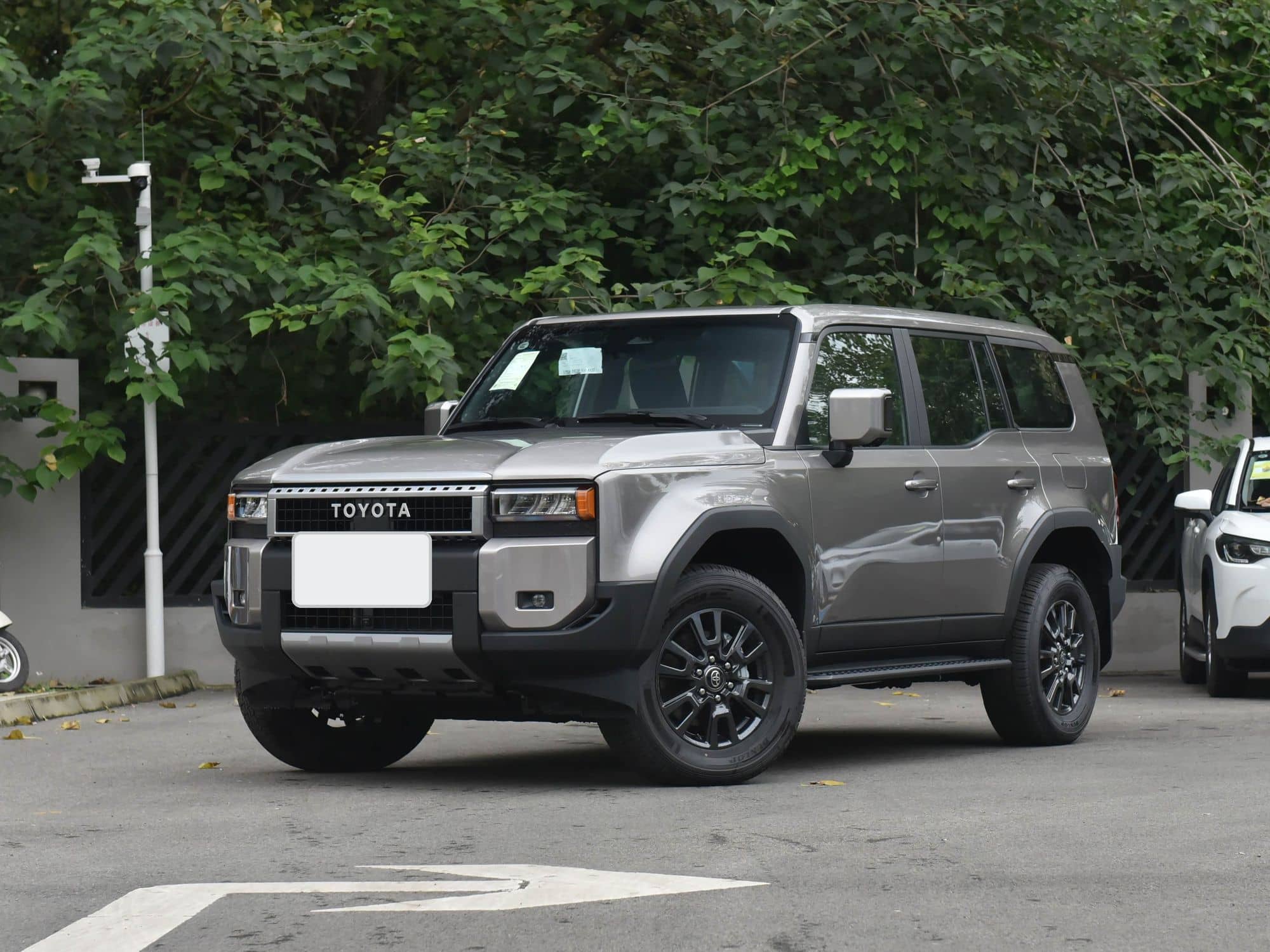 Used 2024 Toyota Land Cruiser Prado LC250 in Platinum Bronze, front three-quarter view
