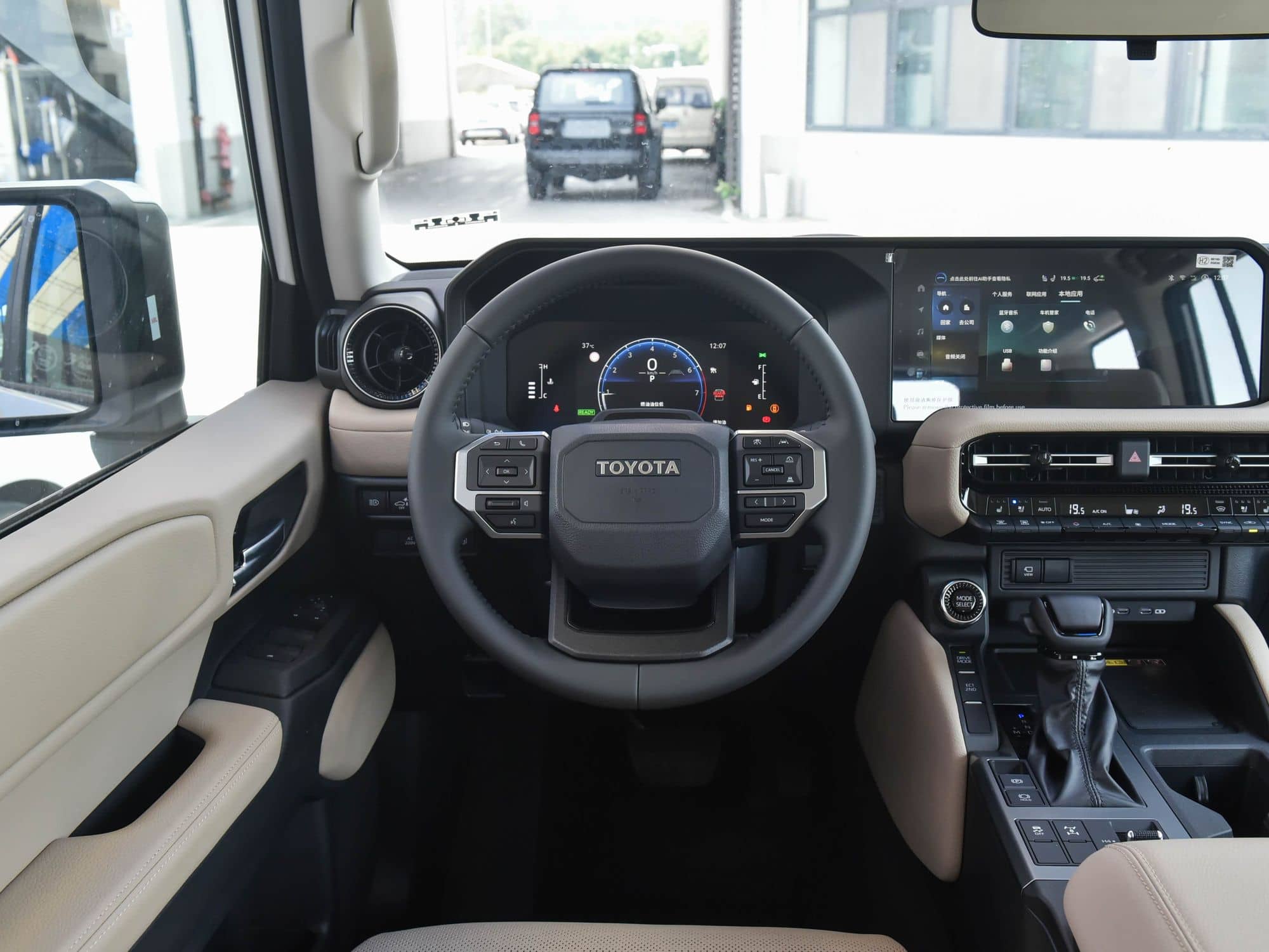 2024 Toyota Land Cruiser Prado (LC250) interior: steering wheel and instrument cluster