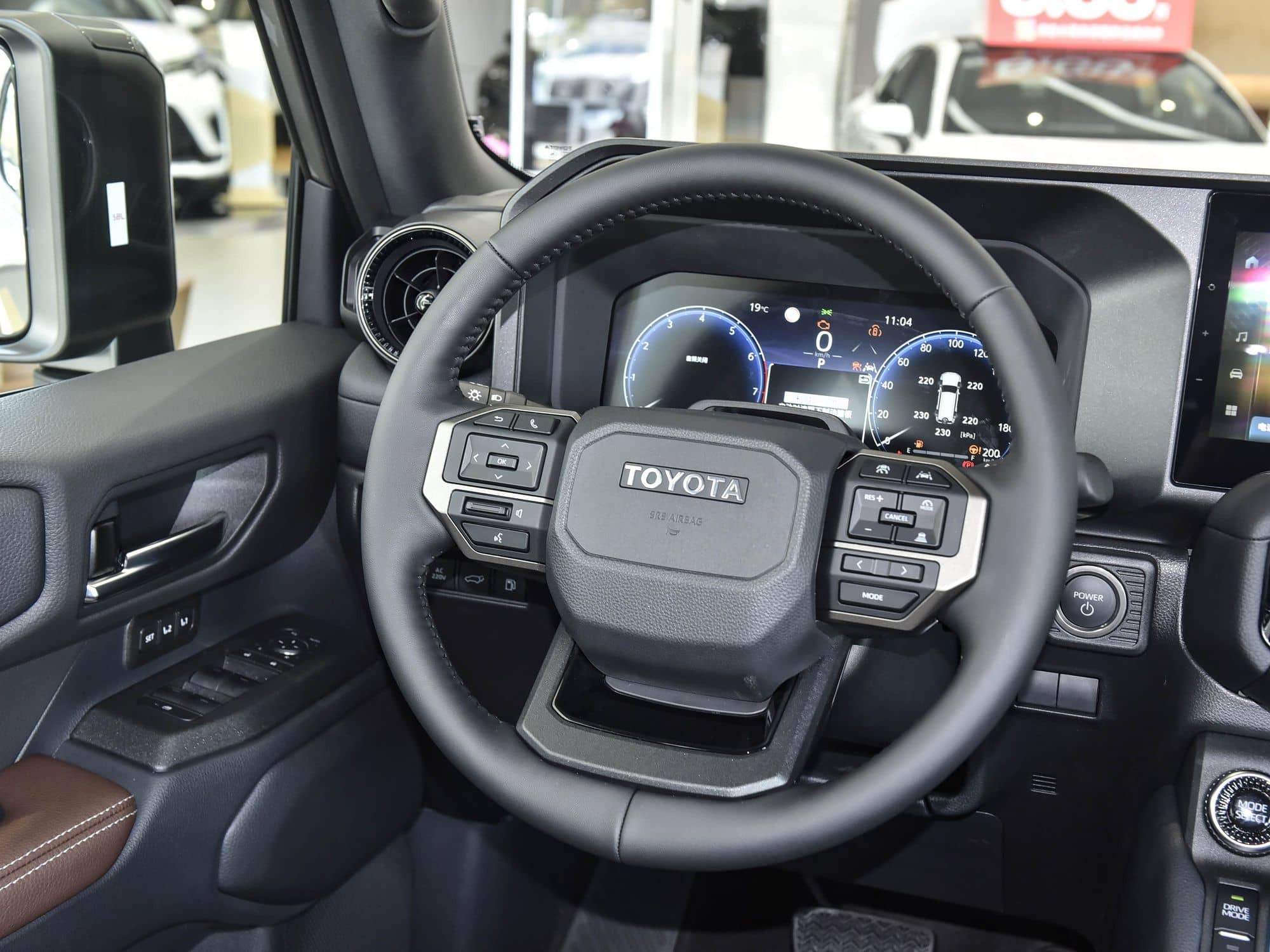 2025 Toyota Land Cruiser Prado (LC250) interior: steering wheel and instrument cluster